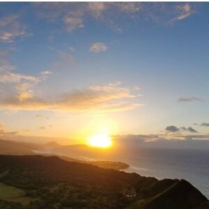 Chipmunk On The Hunt - Breathtaking sunset view over a lush landscape and ocean