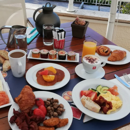 Breakfast buffet at Le Méridien Beach Plaza Monaco with pastries, fruits and hot dishes